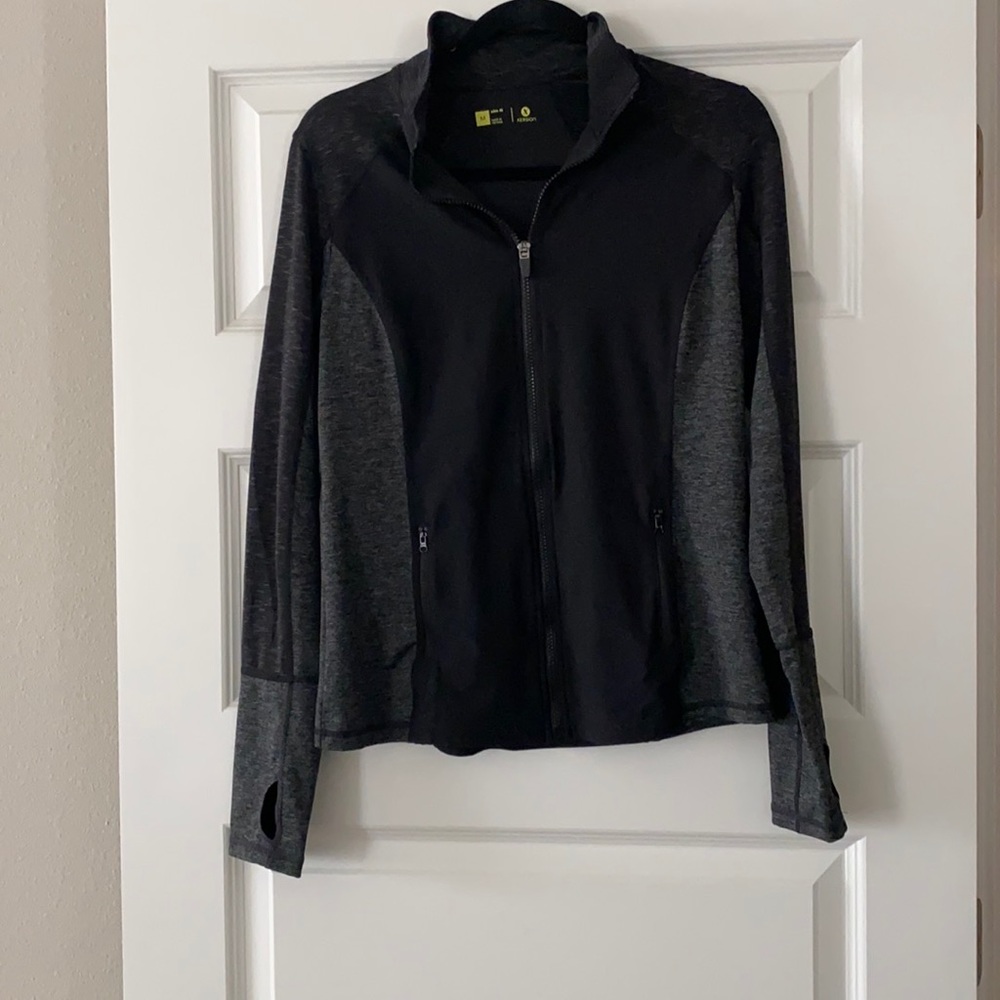 Black/gray fitted athletic top. Size medium.